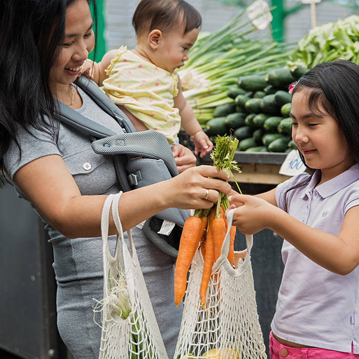 Mother and kids at farmers market