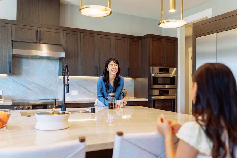 Mother and daughter crafting in the kitchen
